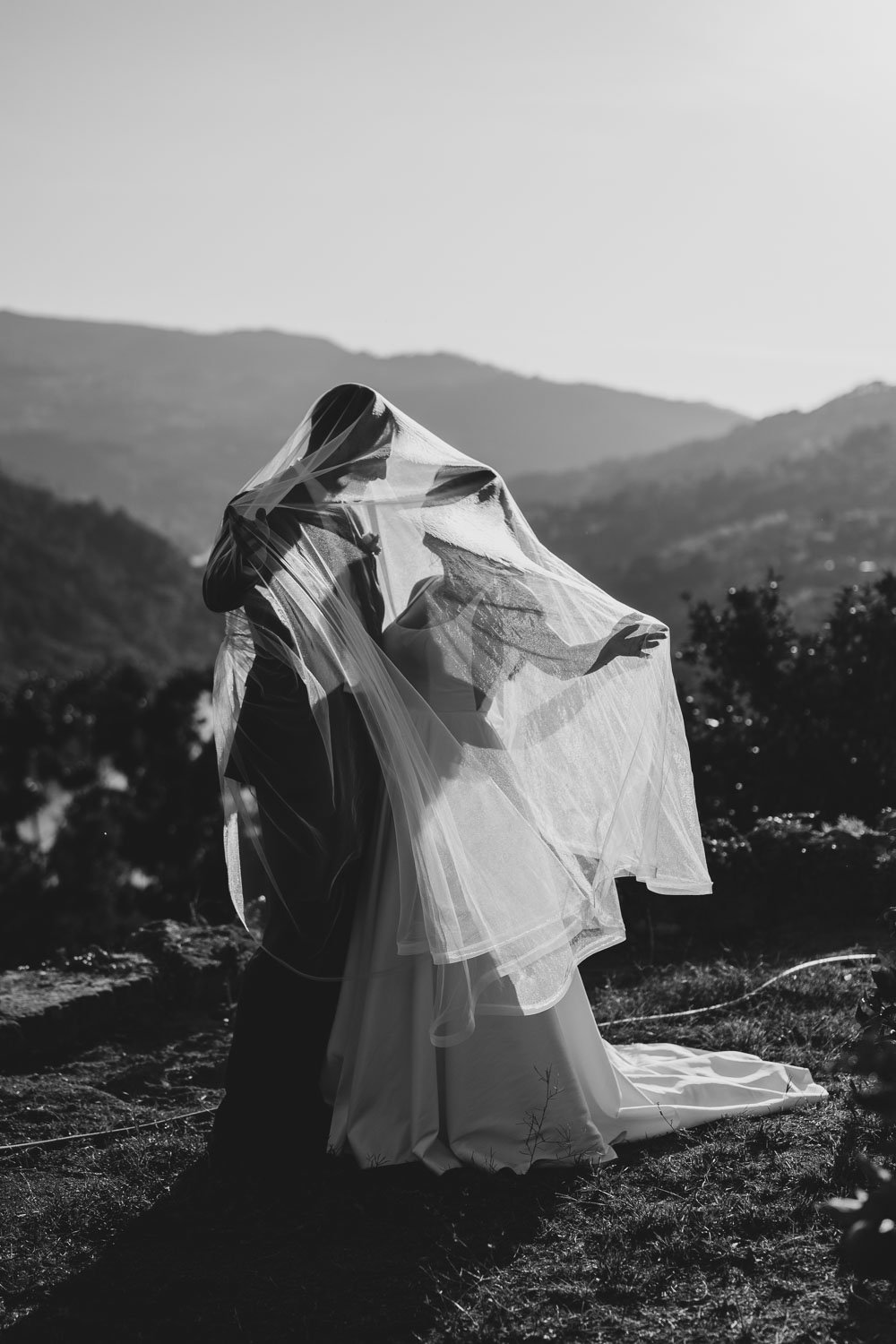 Bride and groom golden hour portraits overlooking the Douro River during an intimate wedding in Portugal