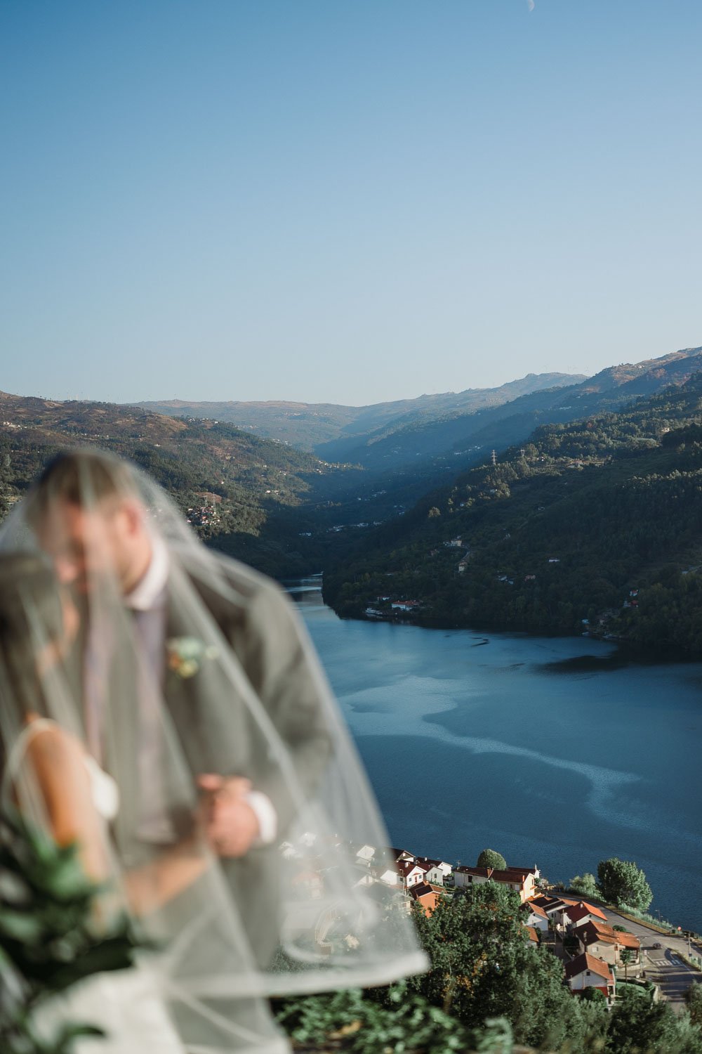 Bride and groom golden hour portraits overlooking the Douro River during an intimate wedding in Portugal