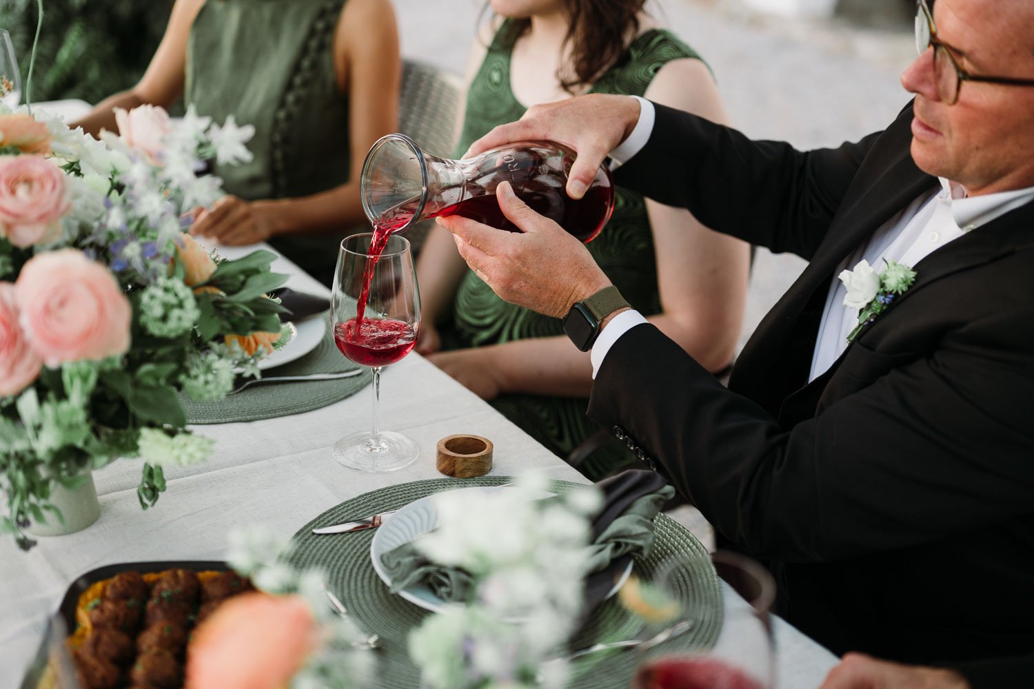 Family toasting during an intimate wedding dinner with private chef in the Douro Valley