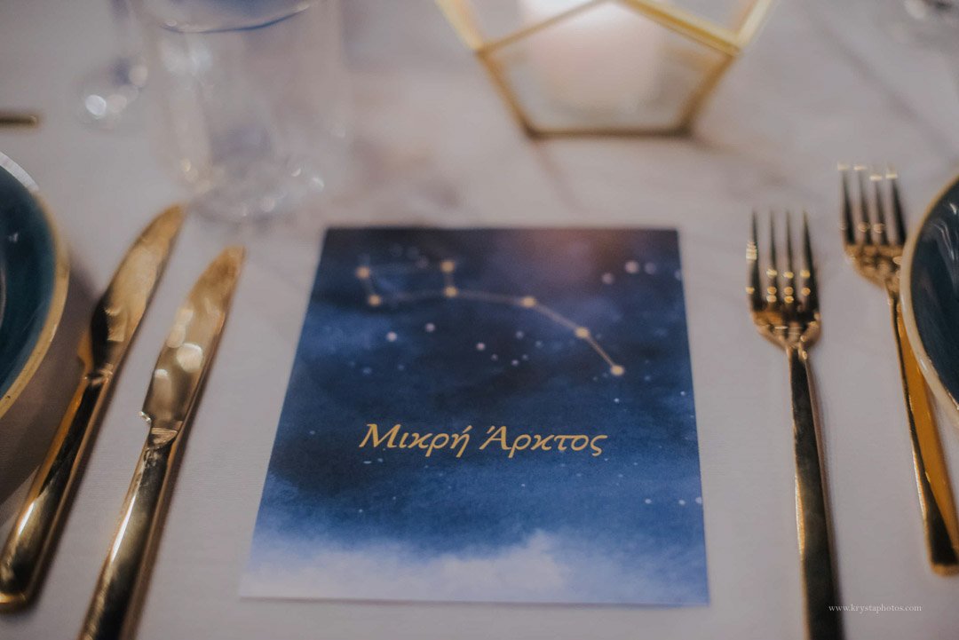 Candlelit seaside wedding dinner in Greece with newlyweds, guests, and live swing music by Gadjo Dilo