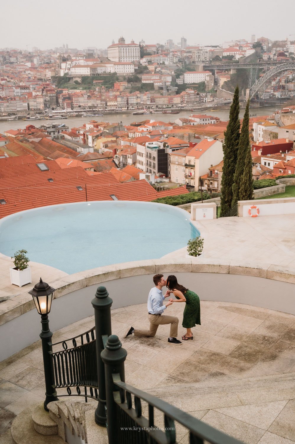 Saying Yes in Porto With a Stunning Skyline Backdrop Couple saying yes to engagement with stunning Porto skyline backdrop and Douro River views